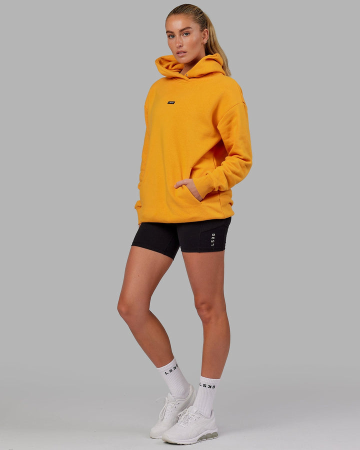 Woman wearing Unisex Fundamental Hoodie Oversize - Butterscotch