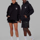 Duo wearing Unisex Good Times Hoodie Oversize - Black-White