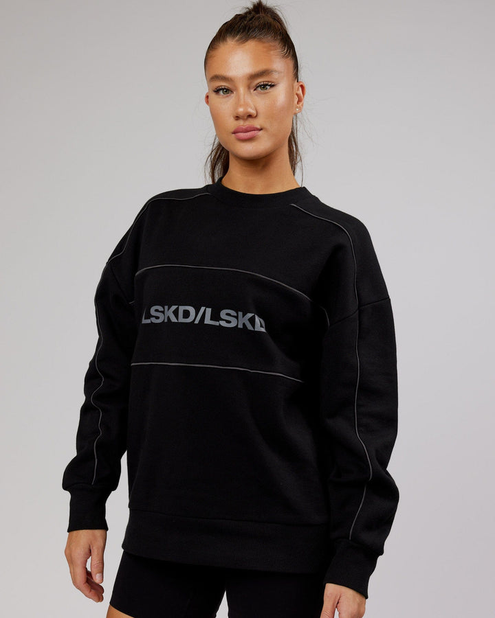 Woman wearing Unisex Impact Sweater Oversize - Black-Grey