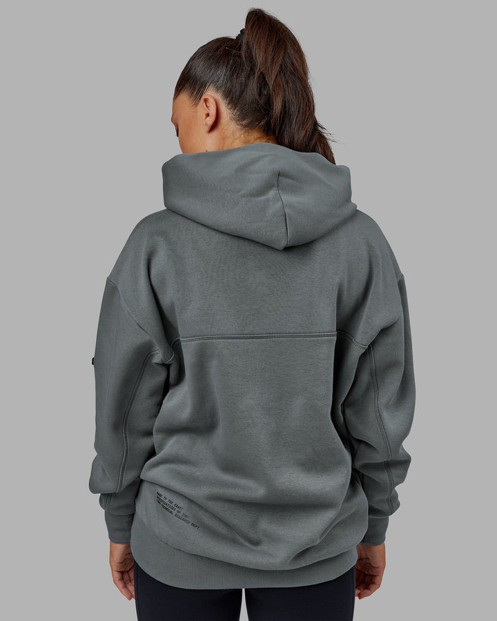 Woman wearing Unisex Lab Hoodie Oversize - Graphite