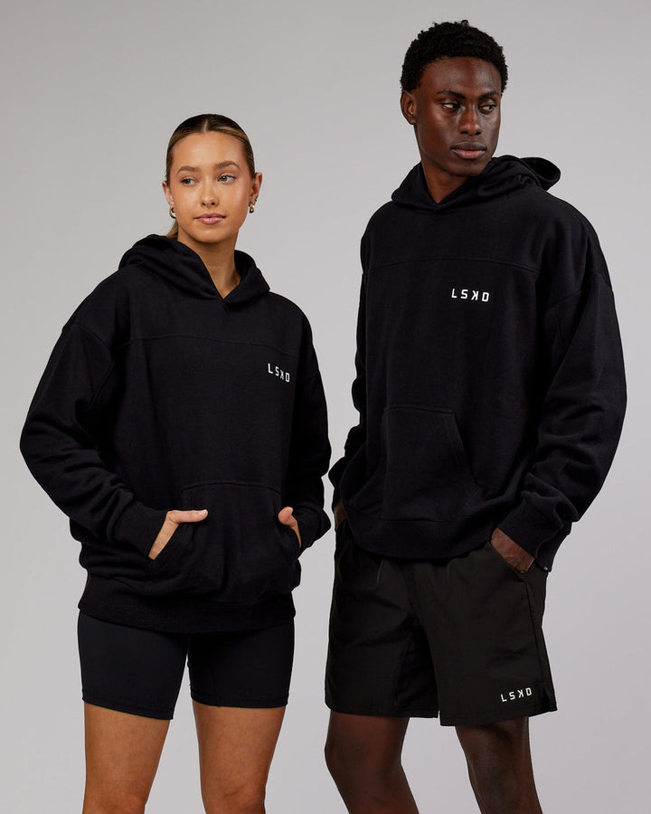 Man and woman wearing Unisex Mode Hoodie Oversize - Black