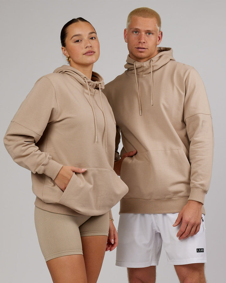 Man and woman wearing Unisex Perimeter FLXFleece Hoodie - Taupe