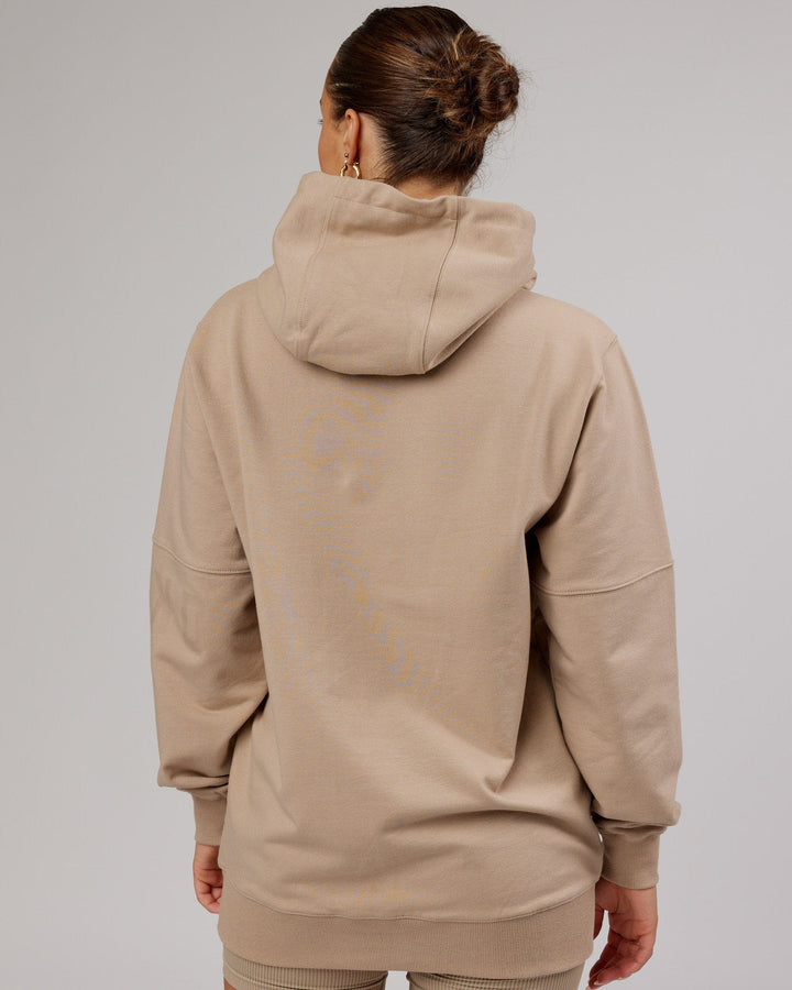 Woman wearing Unisex Perimeter FLXFleece Hoodie - Taupe