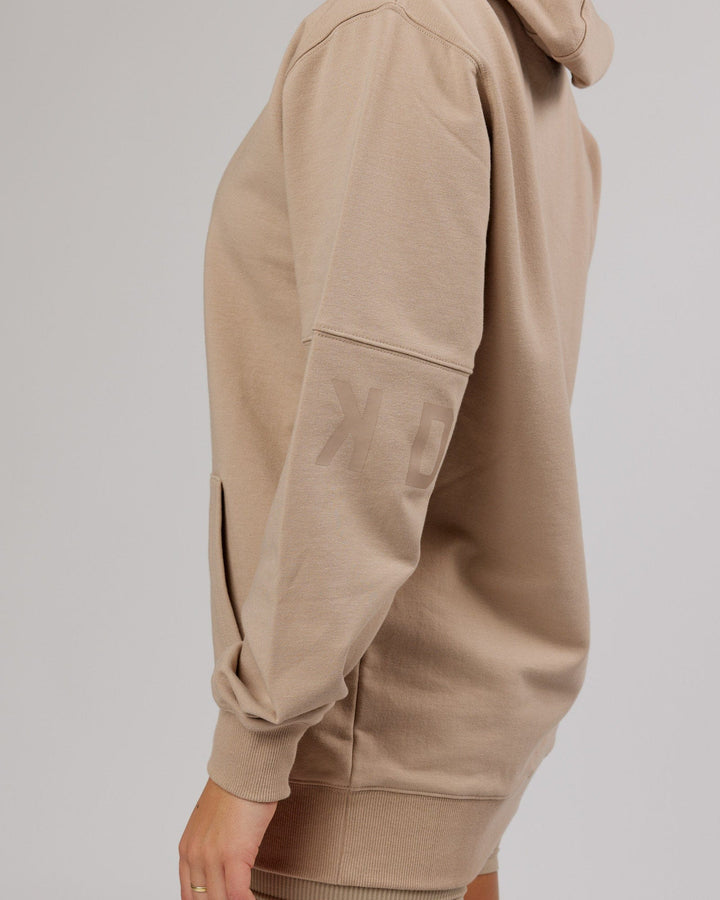 Woman wearing Unisex Perimeter FLXFleece Hoodie - Taupe