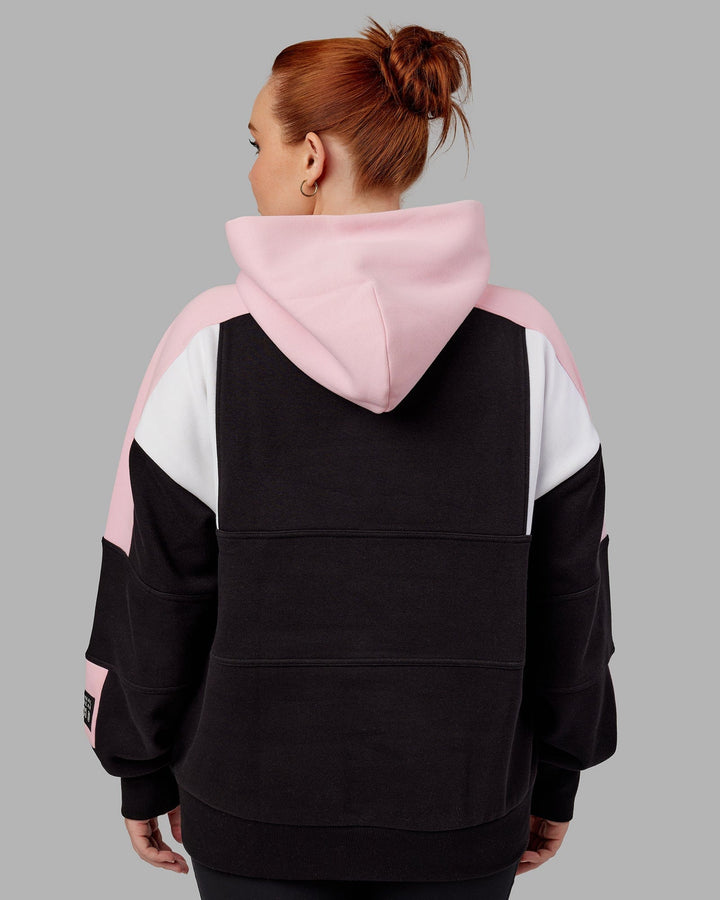 Woman wearing Unisex Slam Hoodie Oversize - Black-Petal Pink