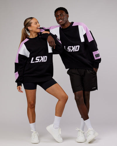 Man and woman wearing Unisex Slam Sweater Oversize - Black-Lilac
