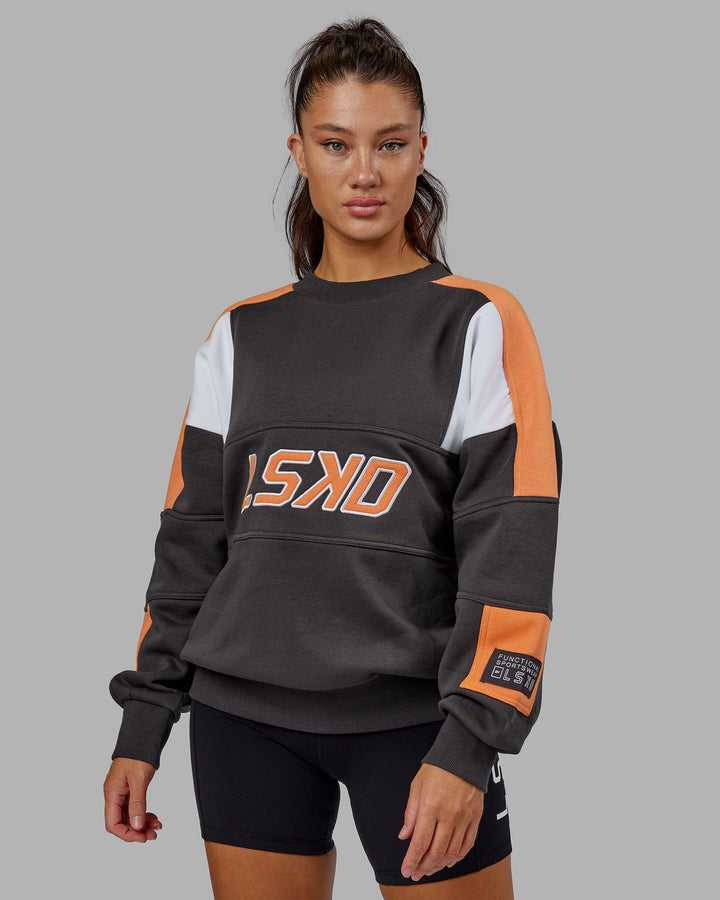 Woman wearing Unisex Slam Sweater Oversize - Asphalt-Tangerine