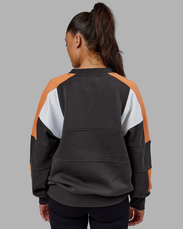 Woman wearing Unisex Slam Sweater Oversize - Asphalt-Tangerine
