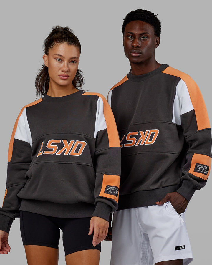 Woman wearing Unisex Slam Sweater Oversize - Asphalt-Tangerine