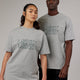Woman and man wearing Unisex Stacks Up Heavyweight Oversize Tee - Lt Grey Marl