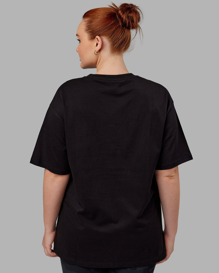 Woman wearing Unisex Standard Heavyweight Tee Oversize - Black-White