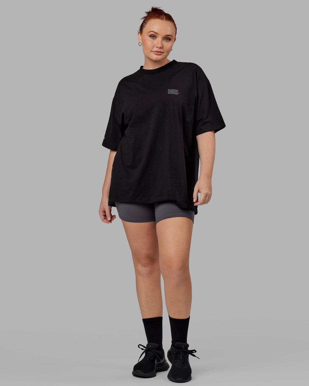 Woman wearing Unisex Strive FLXCotton Tee Oversize - Black-White
