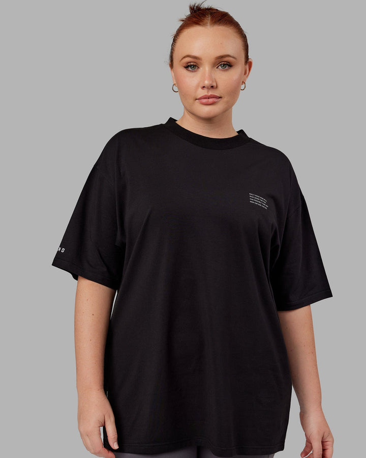 Woman wearing Unisex Strive FLXCotton Tee Oversize - Black-White