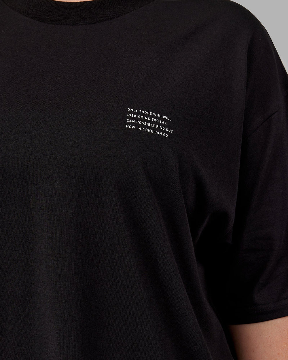 Woman wearing Unisex Strive FLXCotton Tee Oversize - Black-White