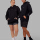 Duo wearing Unisex Trust The Process Hoodie Oversize - Black