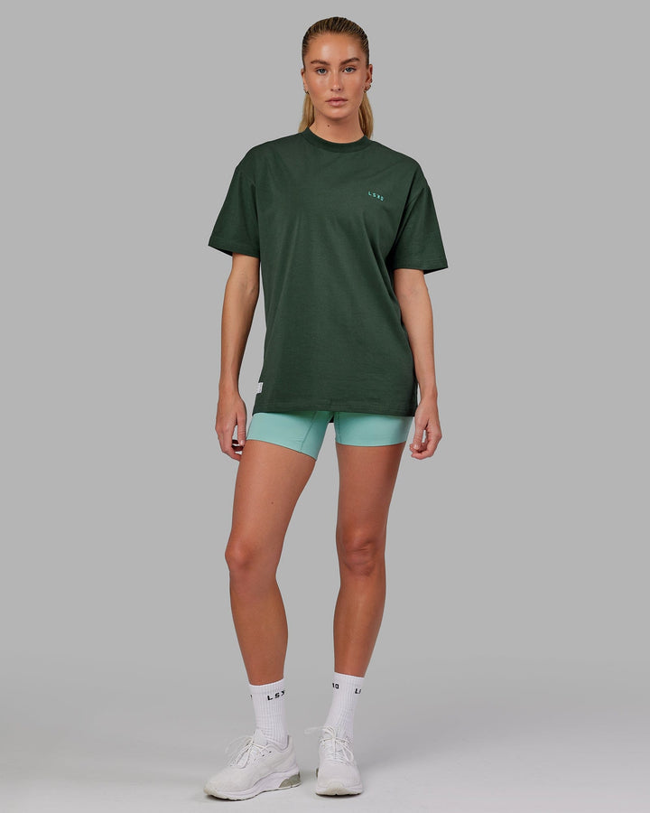 Woman wearing Unisex VS2 FLXCotton Tee Oversize - Vital Green-Teal