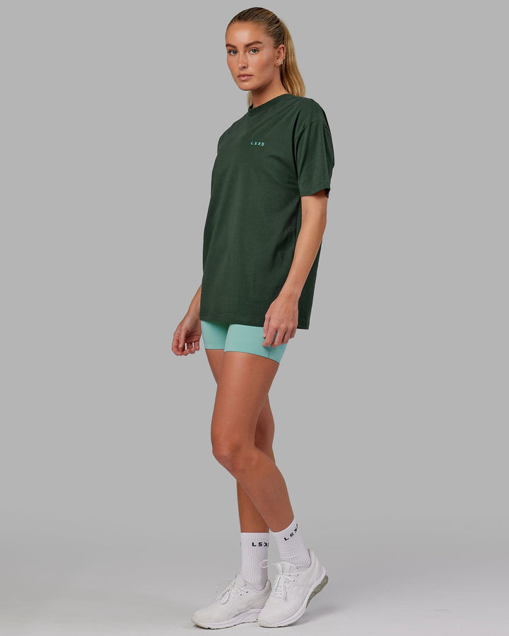 Woman wearing Unisex VS2 FLXCotton Tee Oversize - Vital Green-Teal