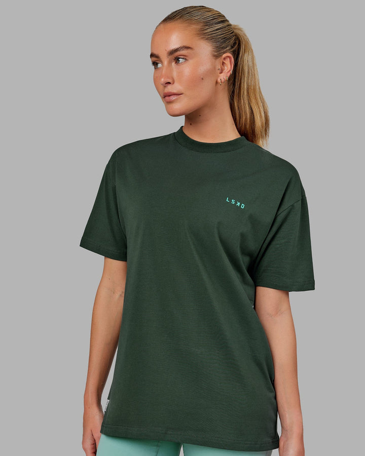 Woman wearing Unisex VS2 FLXCotton Tee Oversize - Vital Green-Teal