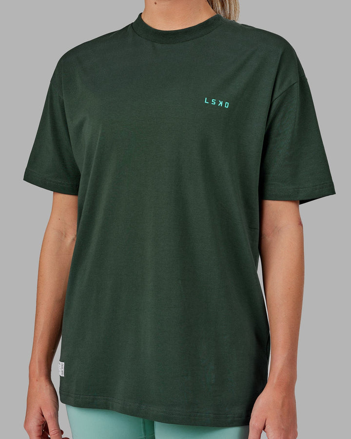 Woman wearing Unisex VS2 FLXCotton Tee Oversize - Vital Green-Teal