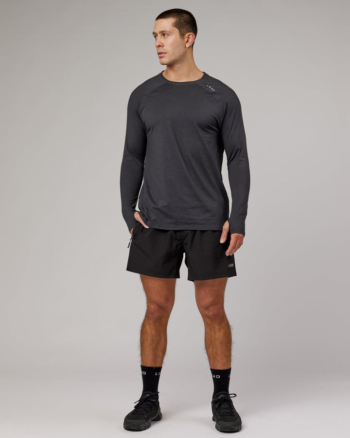 Man wearing Black Marl Perform VapourLFX Long Sleeve Tee