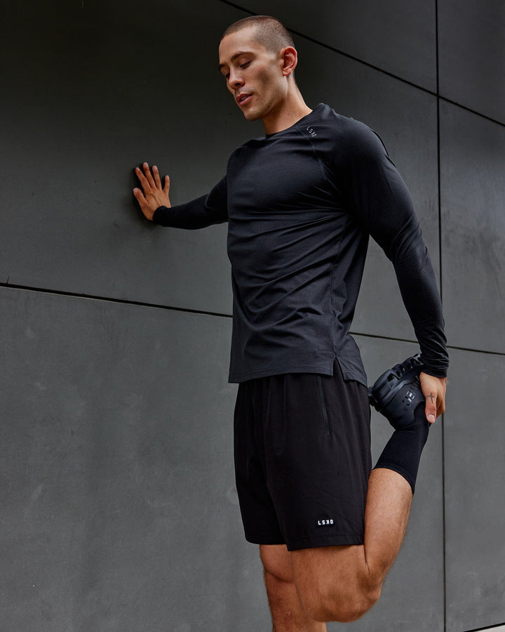 Man wearing Black Marl Perform VapourLFX Long Sleeve Tee