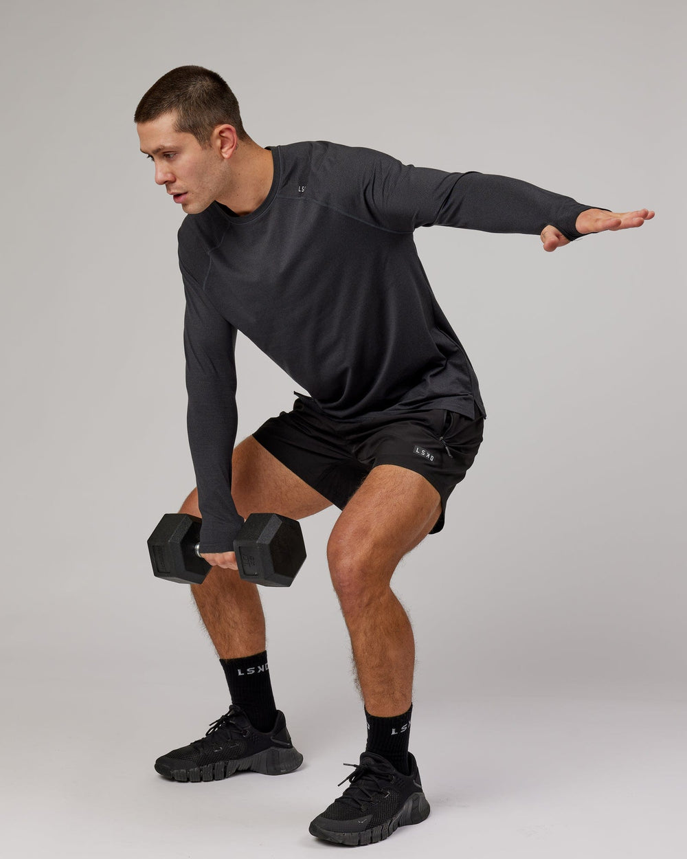 Man wearing Black Marl Perform VapourLFX Long Sleeve Tee
