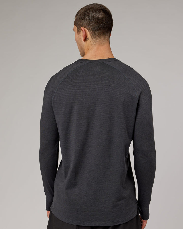 Man wearing Black Marl Perform VapourLFX Long Sleeve Tee