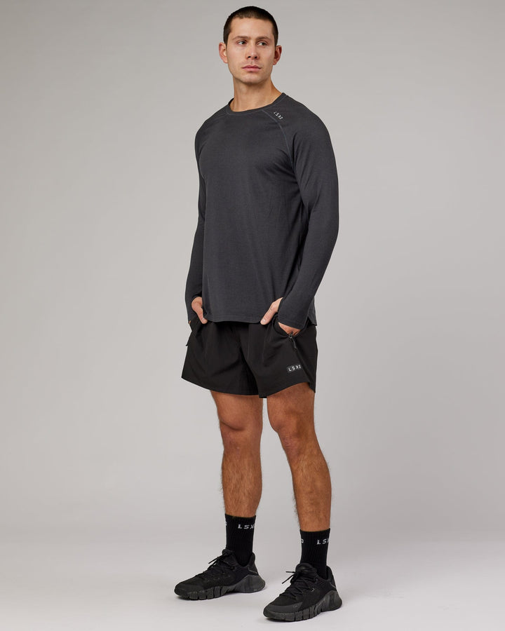Man wearing Black Marl Perform VapourLFX Long Sleeve Tee