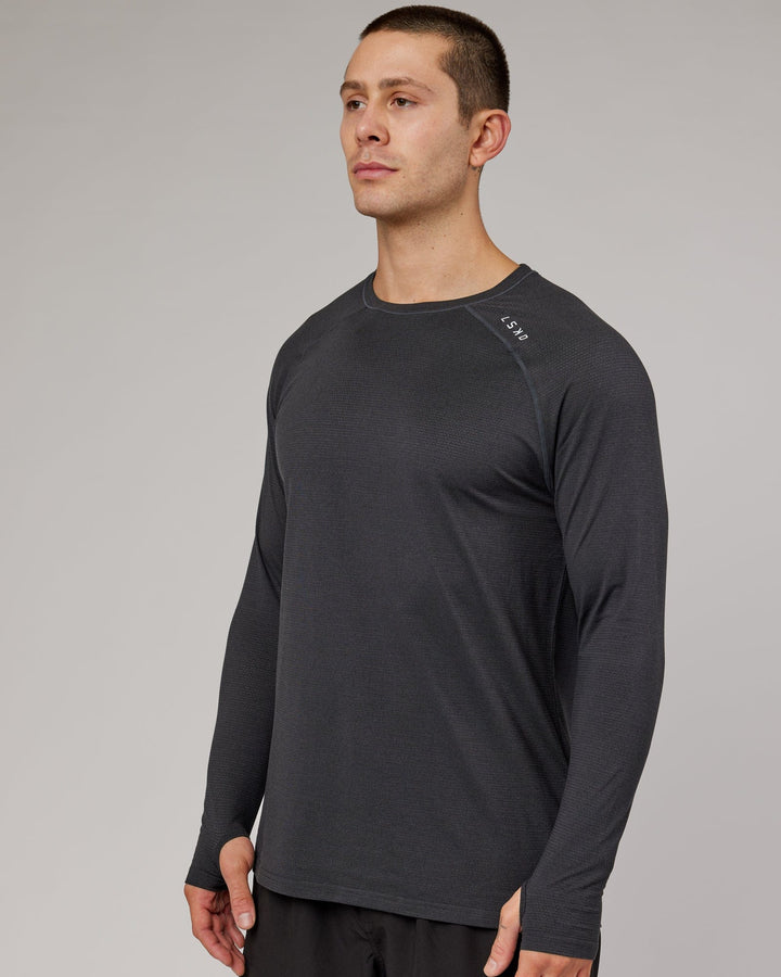 Man wearing Black Marl Perform VapourLFX Long Sleeve Tee