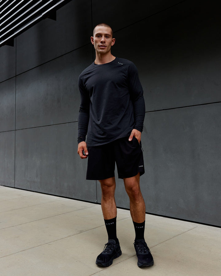 Man wearing Black Marl Perform VapourLFX Long Sleeve Tee