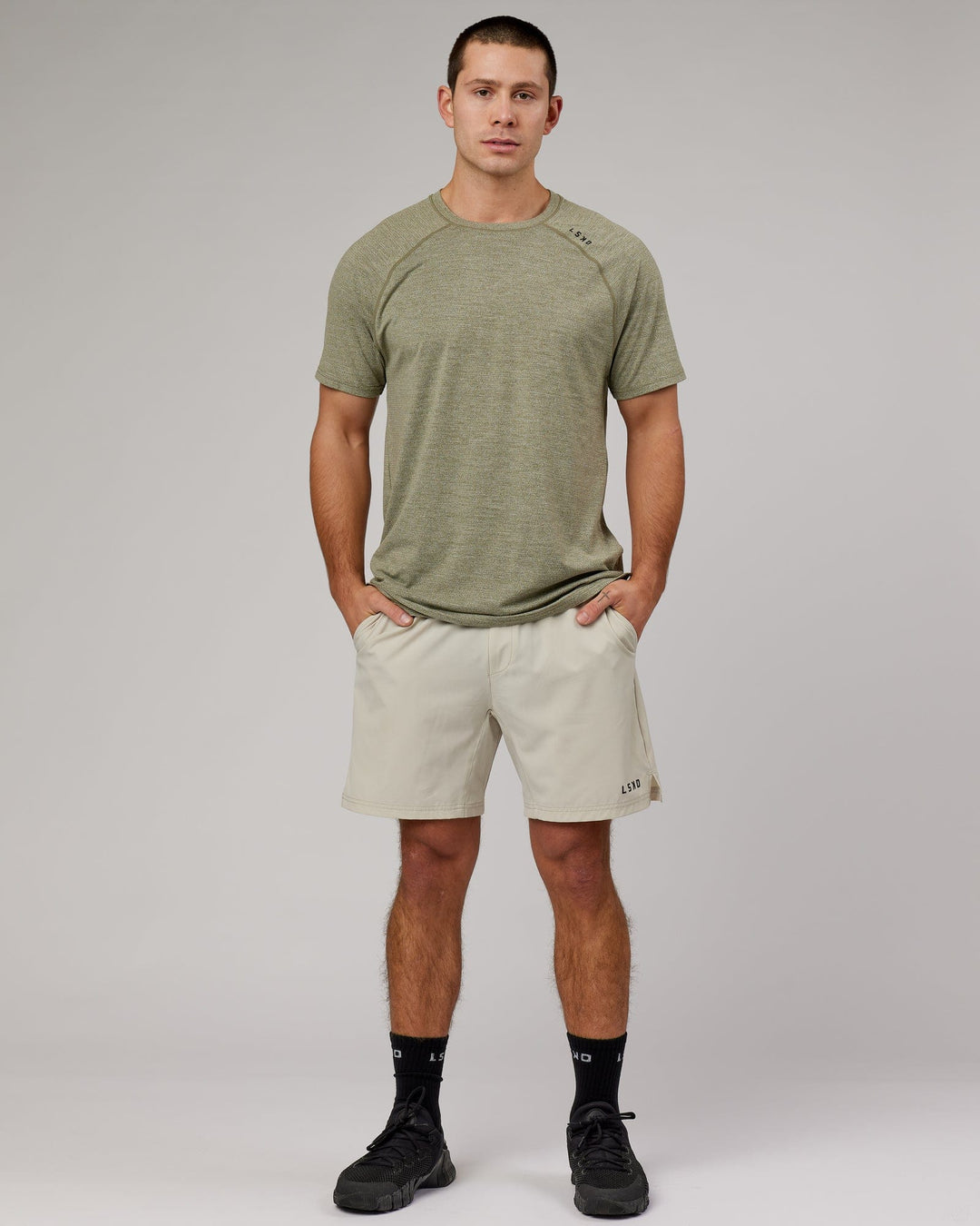 Man wearing Olive Marl Perform VapourLFX Tee