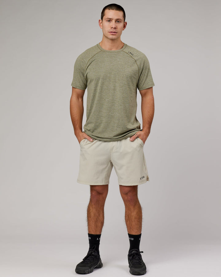Man wearing Olive Marl Perform VapourLFX Tee