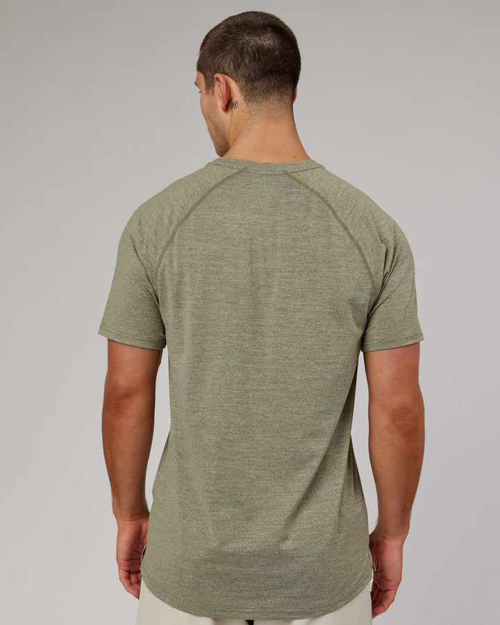 Man wearing Olive Marl Perform VapourLFX Tee