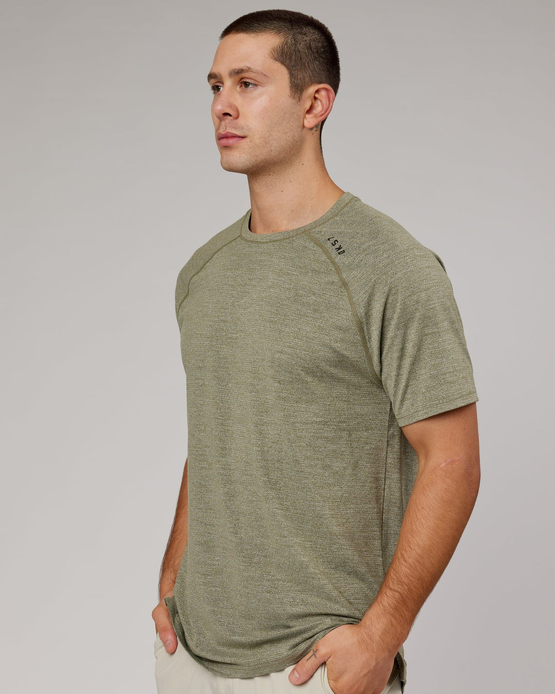 Man wearing Olive Marl Perform VapourLFX Tee
