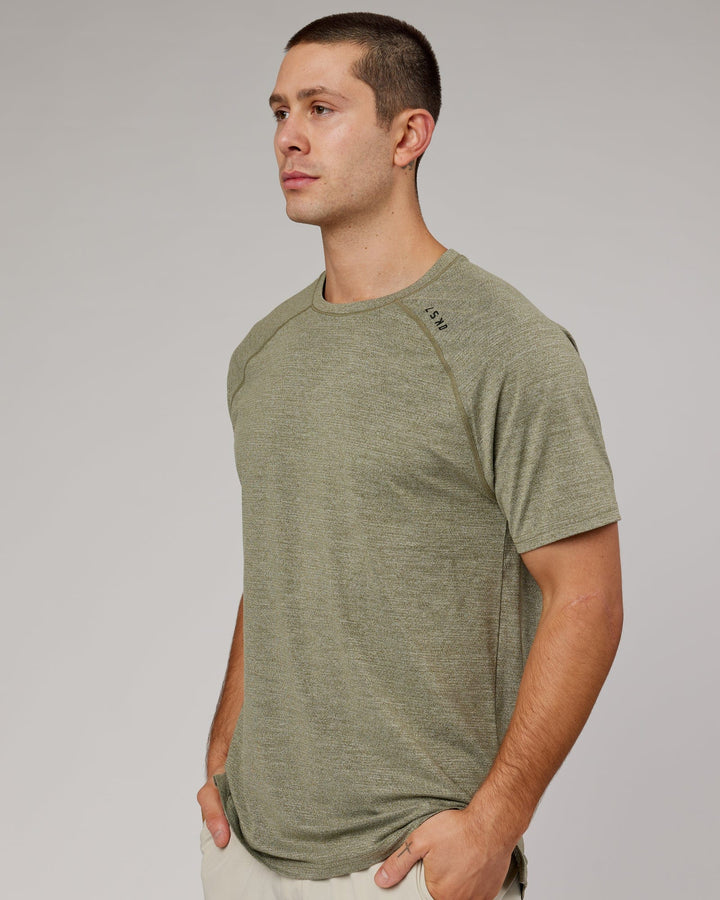 Man wearing Olive Marl Perform VapourLFX Tee