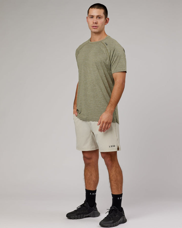 Man wearing Olive Marl Perform VapourLFX Tee