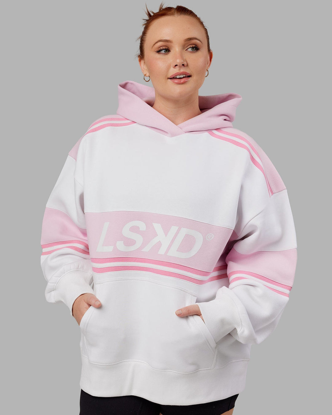Woman wearing Unisex A-Team Hoodie Oversize - White-Petal Pink