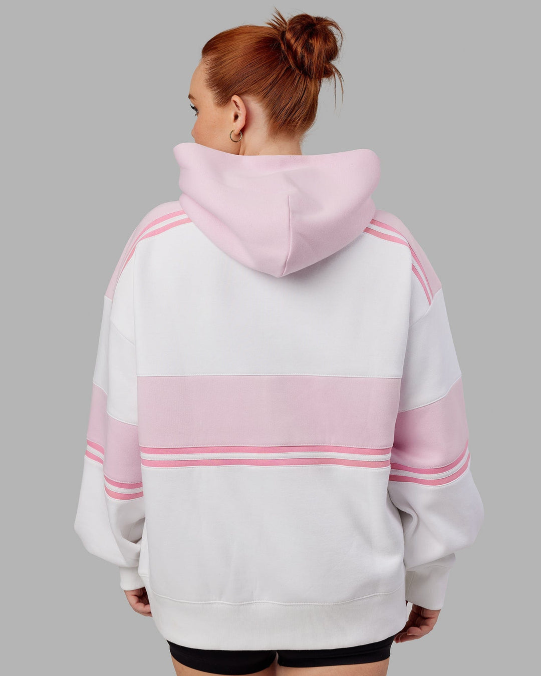Woman wearing Unisex A-Team Hoodie Oversize - White-Petal Pink