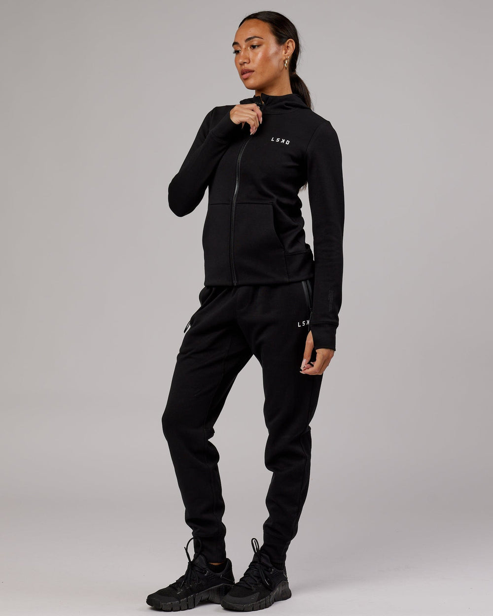 Wiman wearing Athlete ForgedFleece Zip Through Hoodie - Black