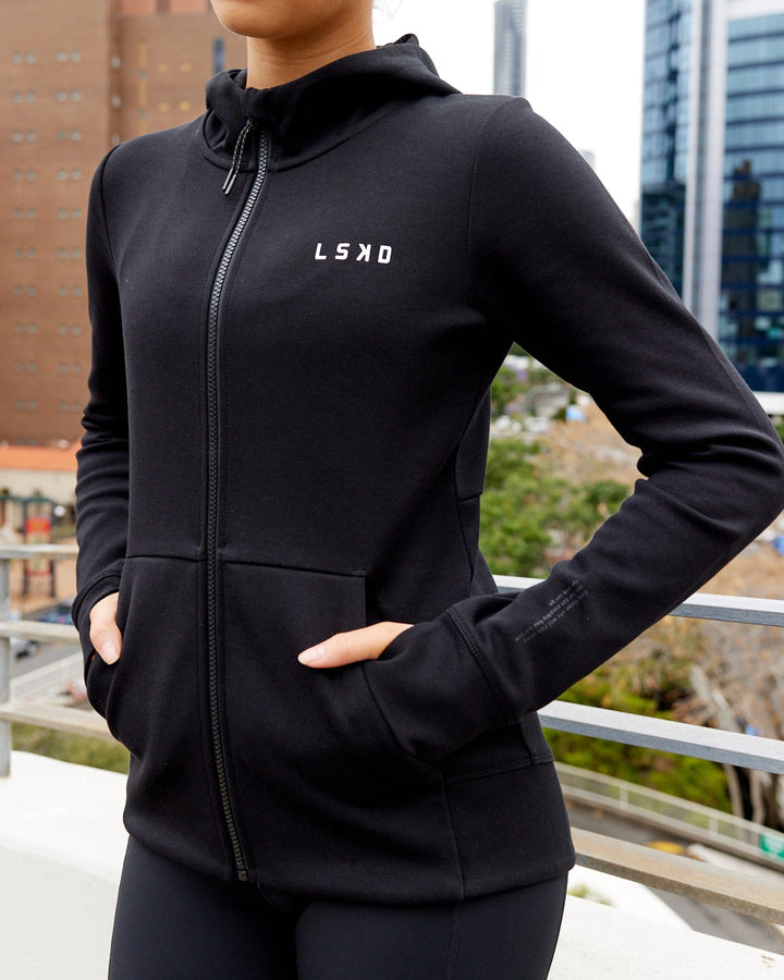 Wiman wearing Athlete ForgedFleece Zip Through Hoodie - Black