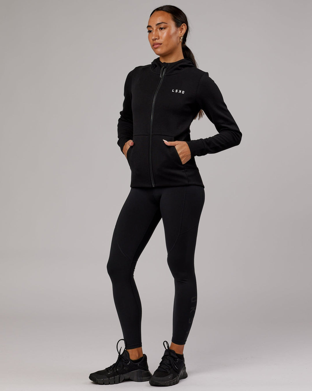 Wiman wearing Athlete ForgedFleece Zip Through Hoodie - Black