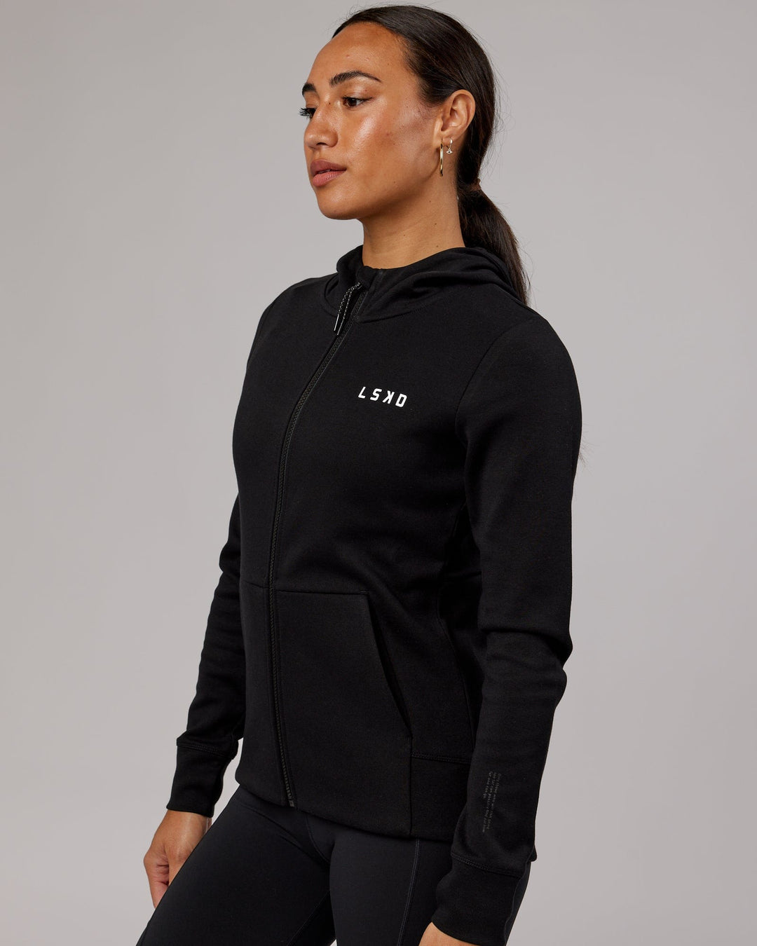 Wiman wearing Athlete ForgedFleece Zip Through Hoodie - Black