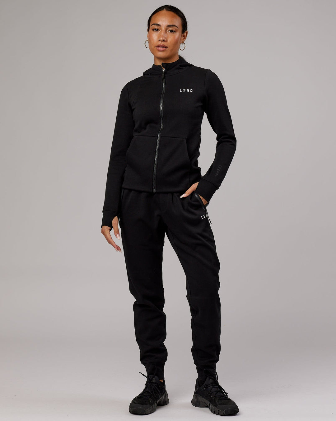 Wiman wearing Athlete ForgedFleece Zip Through Hoodie - Black