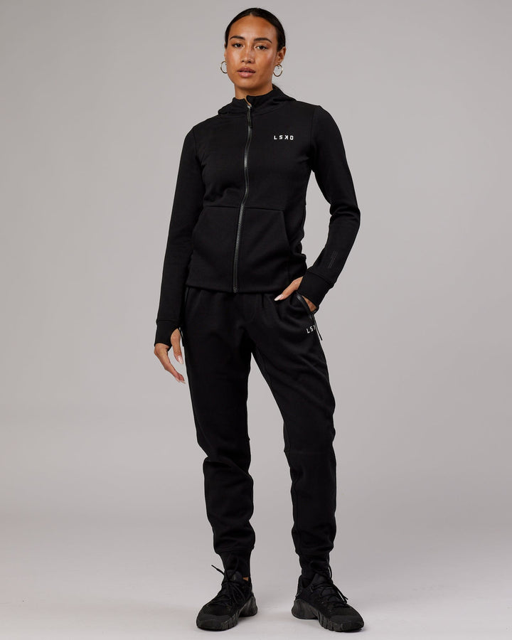 Wiman wearing Athlete ForgedFleece Zip Through Hoodie - Black