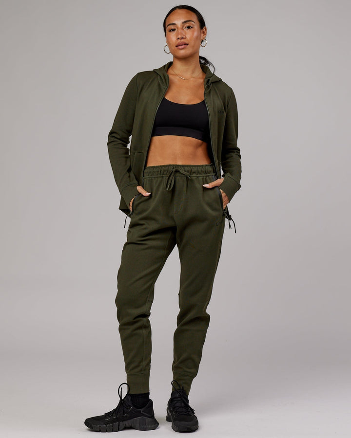 Woman wearing Athlete ForgedFleece Track Pant - Forest Night