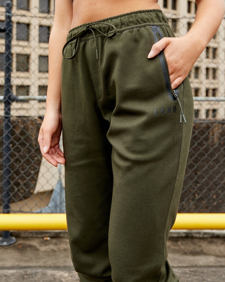 Woman wearing Athlete ForgedFleece Track Pant - Forest Night