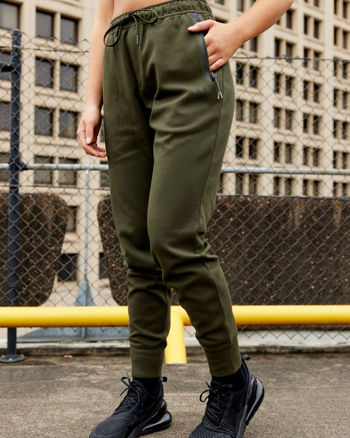Woman wearing Athlete ForgedFleece Track Pant - Forest Night