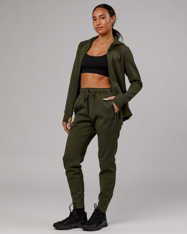 Woman wearing Athlete ForgedFleece Track Pant - Forest Night
