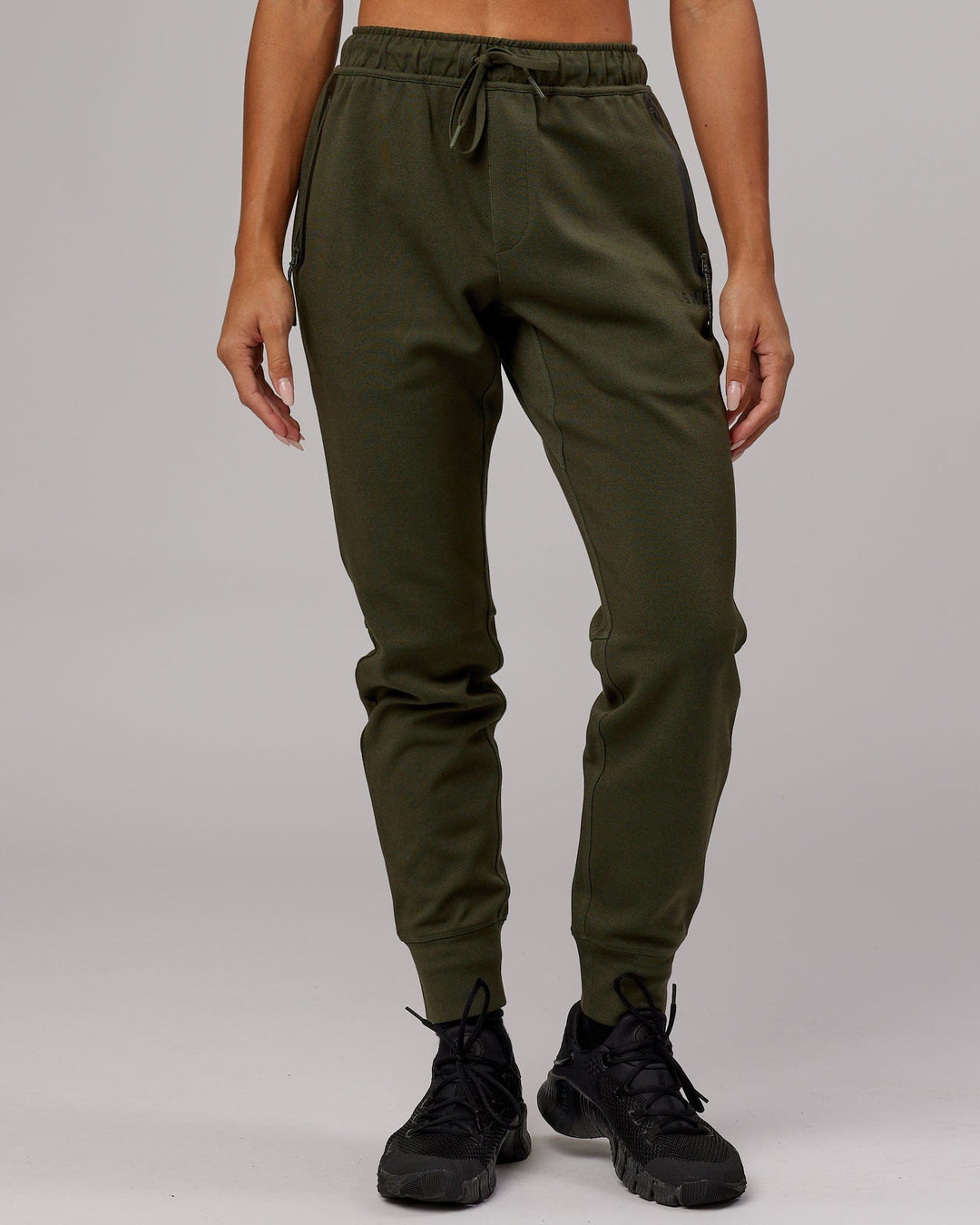 Woman wearing Athlete ForgedFleece Track Pant - Forest Night