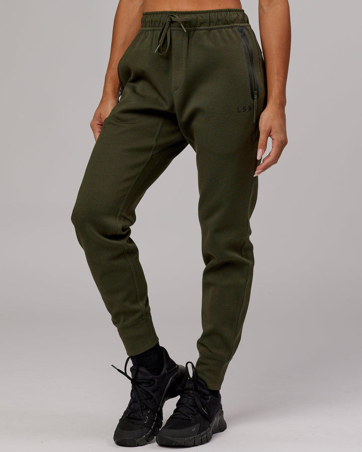Woman wearing Athlete ForgedFleece Track Pant - Forest Night